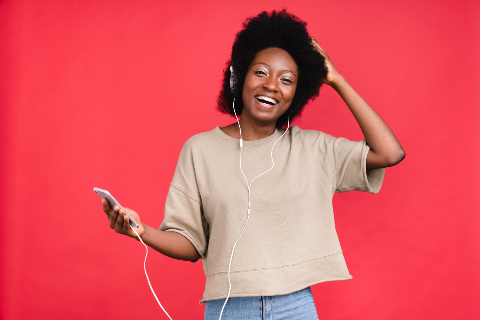 A listener wearing headphones